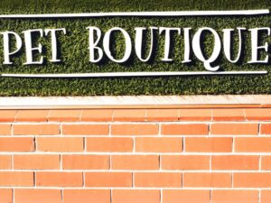 Pet boutique written on a brick face wall