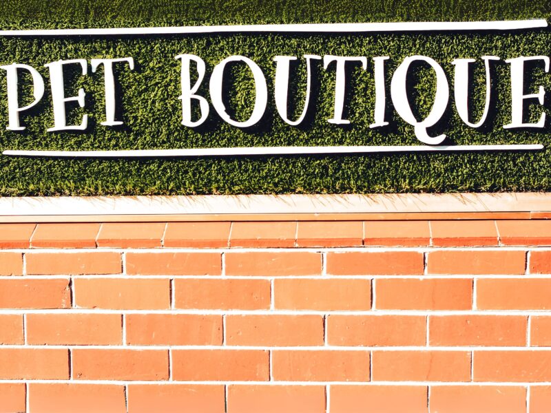 Pet boutique written on a brick face wall